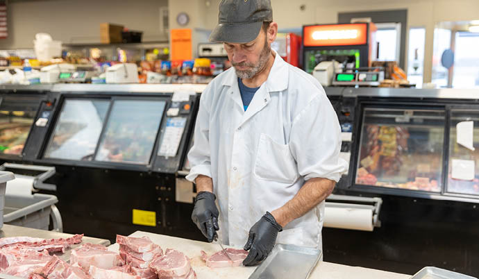 Dan Kraft working at butcher shop