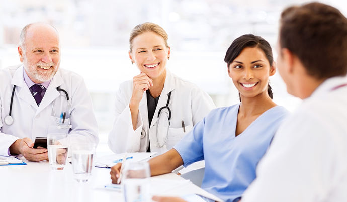 group of doctors talking at a table