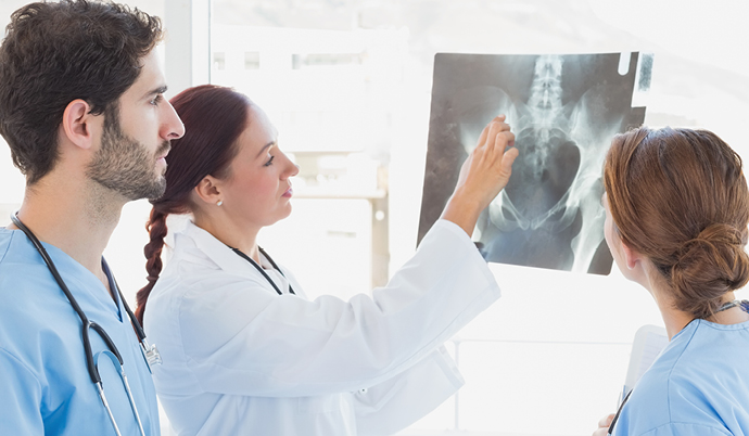 radiologists examining an xray
