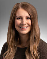 Headshot of Kaitlyn Fritz with long brown hair