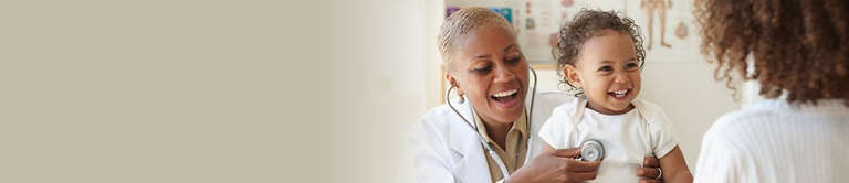 doctor using a stethoscope on a toddler