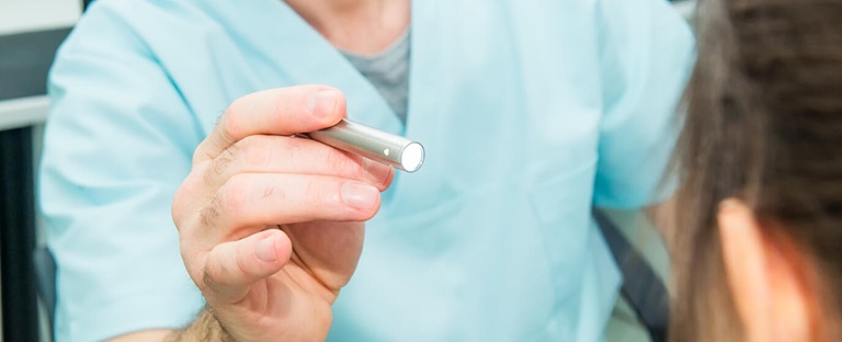 Nurse performing a check-up.