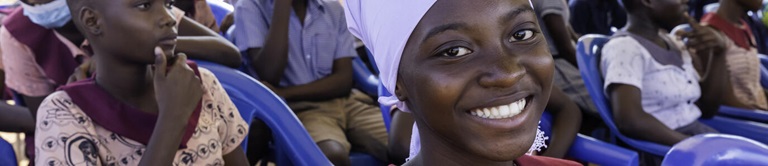 Woman in Ghana smiling at the camera
