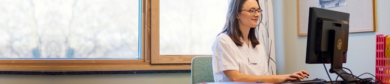 nurse working on a computer