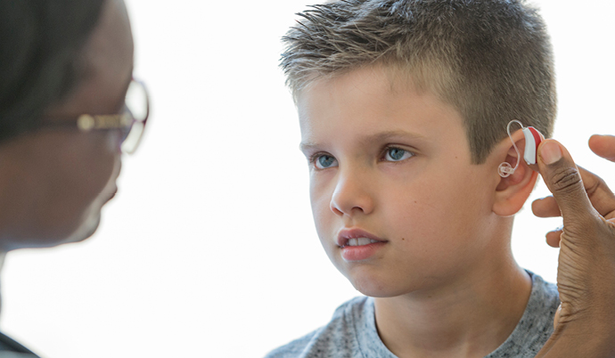 boy with hearing aid