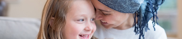 Gynecologic Cancer patient smiling with young daughter