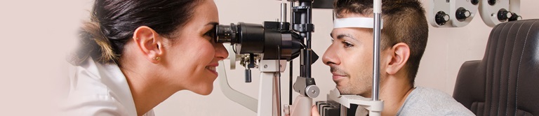 doctor examining a patients eyes