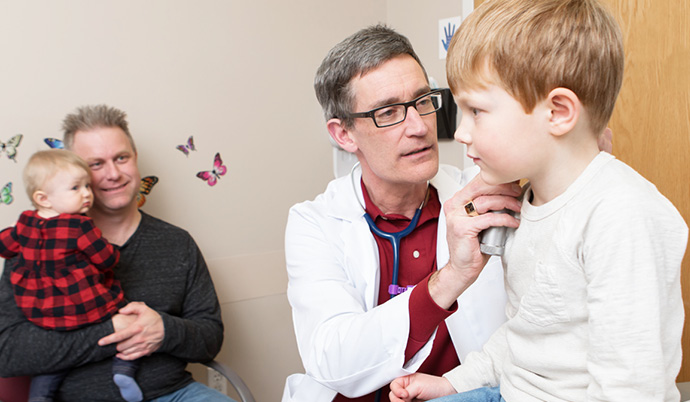steven quamme interacting with young patient