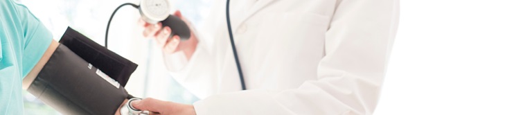 doctor checking a patients blood pressure