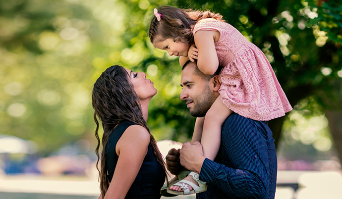 family with little girl outside