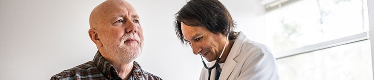 Nurse getting the heart rate of a patient. 
