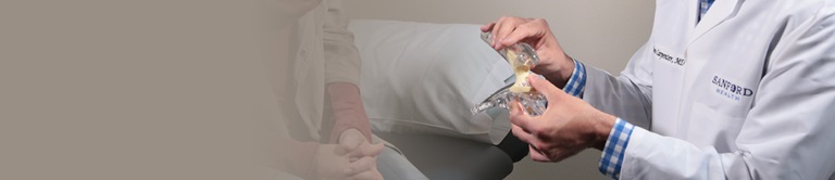 doctor showing patient a model