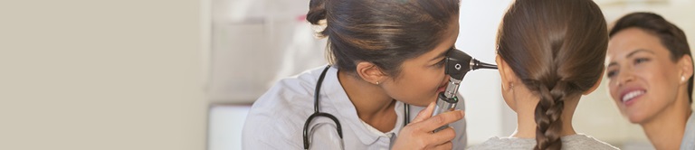 doctor examining a childs ear