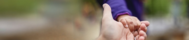 holding young boys hand