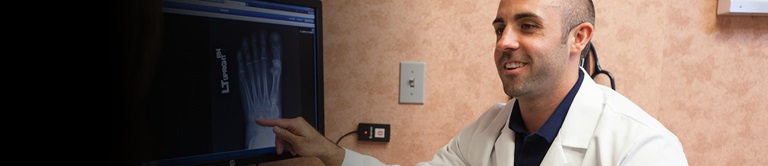 doctor pointing at a foot xray