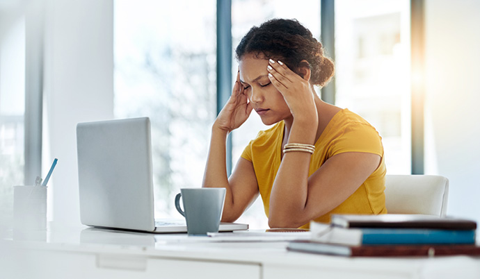 stressed woman at a computer