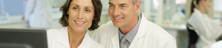 doctors looking at a computer screen together