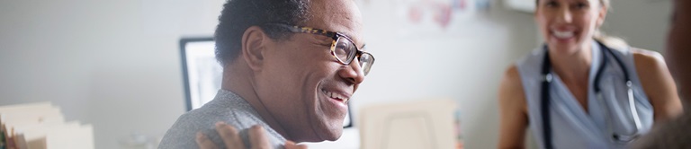 man smiling in a hospital room