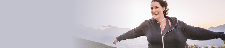 woman with arms stretched outside