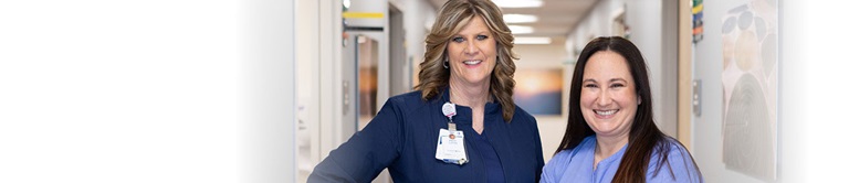 Two nurses smiling.