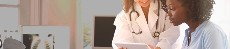 doctor talking with a patient in an exam room