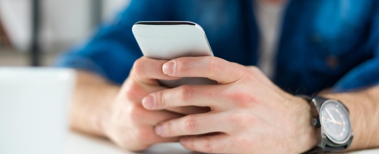 Man texting on his phone