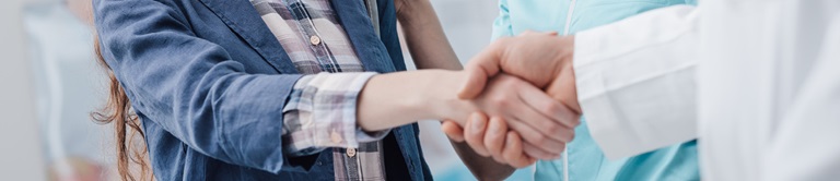 woman shaking hands with a doctor