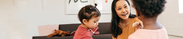 woman talking with small children