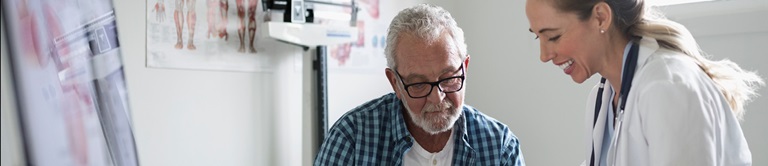 doctor talking to older patient